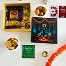 Traditional Diwali hamper with Maharashtrian chivda, laddoo, soan papdi, dry fruit chocolates, brass diyas, and festive card