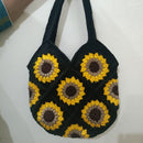 Shop this handmade crochet sunflower bag with a lined interior and inner zip pocket