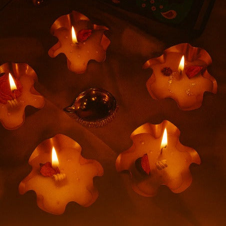 Decorative candles with a Diwali-themed background