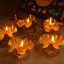 Decorative candles in brass holders with a 'Happy Diwali' card in the background.